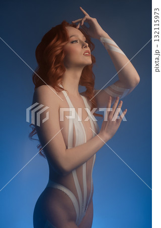 Beauty woman in studio showcasing body art with tape and fur elements 132115973