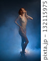 Body art featuring a woman with fur and tape in a creative studio setting 132115975
