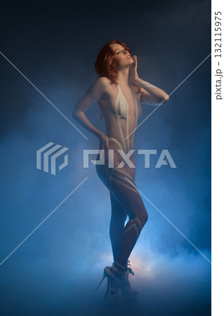 Body art featuring a woman with fur and tape in a creative studio setting 132115975