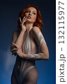 Beauty woman showcasing artistic body art in a studio setting 132115977