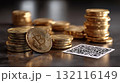 Stacks of golden bitcoin coins placed near a QR code on a reflective surface 132116149
