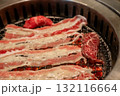 Sliced brisket on the  grill. BBQ rare meat with soft focus 132116664