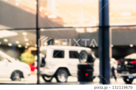 Blurred background with car dealership exterior. Abstract blurred photo of modern building motor showroom. Blur car show room office bokeh lights. Automobile retail shop 132119670