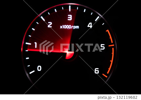 Close up shot of tachometer in car. Car dashboard. Dashboard details with indication lamps.Car instrument panel. Dashboard with tachometer isolated on black background 132119682