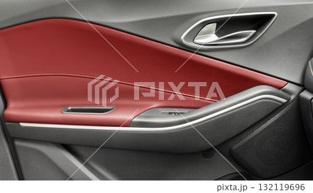 Door handle with Power window control buttons of a luxury passenger car. Red leather interior of the luxury modern car. Modern car interior details 132119696