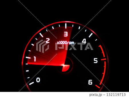 Close up shot of tachometer in car. Car dashboard. Dashboard details with indication lamps.Car instrument panel. Dashboard with tachometer isolated on black background Close up shot of tachometer in car. Car dashboard. Dashboard details with indication lamps.Car instrument panel. Dashboard with tachometer isolated on black background 132119713