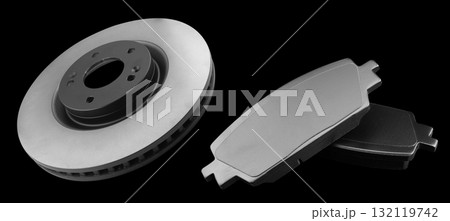 Brake discs and brake pads isolated on black background. Auto parts. Brake disc rotor isolated. Braking disk. Car part. Quality spare parts for car service or maintenance 132119742