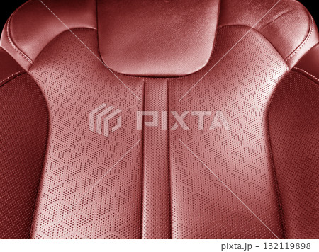 Car red leather interior. Part of red leather car seat details with white stitching. Interior of prestige car. Perforated leather seats isolated. Perforated leather. Car red leather interior. Part of red leather car seat details with white stitching. Interior of prestige car. Perforated leather seats isolated. Perforated leather. 132119898