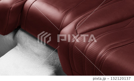 Car inside. Interior of prestige modern car. Comfortable leather seats. Red perforated leather. Back passenger seats. 132120137