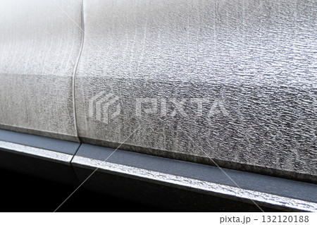 Side view of a very dirty car. Fragment of a dirty car. Dirty headlights, wheel and bumper of the car with swamp splashes on a side panel Side view of a very dirty car. Fragment of a dirty car. Dirty headlights, wheel and bumper of the car with swamp splashes on a side panel 132120188