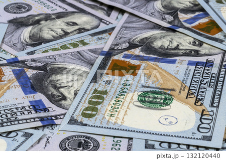 Stack of one hundred dollar bills. Stack of cash money in hundred dollar banknotes. Heap of hundred dollar bills background. Concept of financial success. 132120440