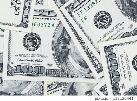Stack of one hundred dollar bills. Stack of cash money in hundred dollar banknotes. Heap of hundred dollar bills background. Concept of financial success. 132120441