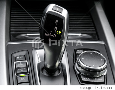 Automatic gear stick of a modern car. Car interior details. Transmission shift. Automatic gear stick of a modern car. Car interior details. Transmission shift. 132120444