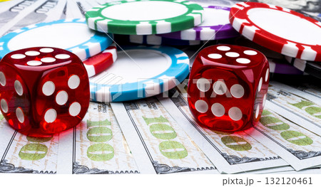 Stack of Poker chips with dice rolls on a dollar bills, Money. Poker table at the casino. Poker game concept. Playing a game with dice. Casino dice rolls. 132120461