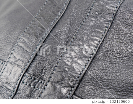 Macro shot leather texture background. Part of perforated leather details. Perforated leather texture background. Texture leather 132120600