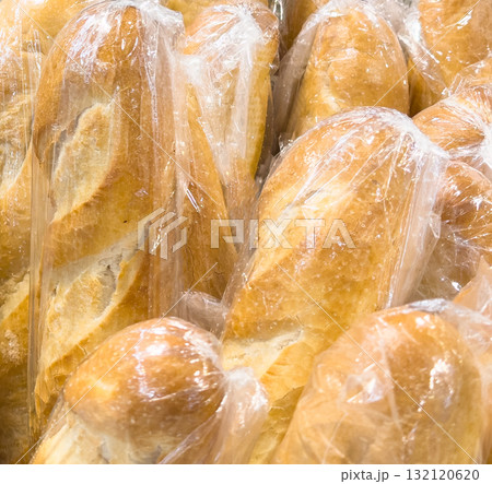 Buns in wicker basket. Composition with bread and rolls 132120620