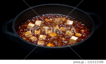 Close Up Of Delicious Tofu Dish Simmering In A Dark Cast Iron Pan. 132121599
