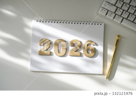 Golden numbers 2026 on notebook, golden pen and keyboard part, bathed in soft sunlight. Planning, goals, new beginnings. Ideal for business, education Golden numbers 2026 on notebook, golden pen and keyboard part, bathed in soft sunlight. Planning, goals, new beginnings. Ideal for business, education 132121976