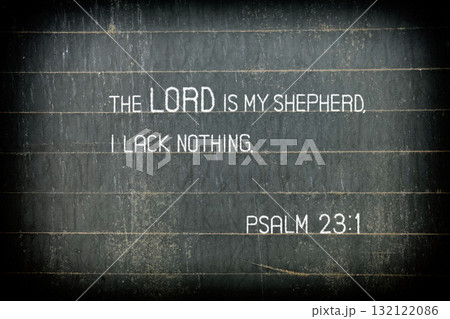 The Bible verse Psalm 23:1. The text reads: "The Lord is my shepherd, I lack nothing." on chalkboard. The Bible verse Psalm 23:1. The text reads: "The Lord is my shepherd, I lack nothing." on chalkboard. 132122086