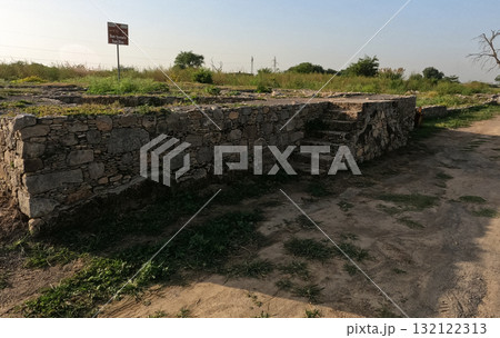 Ancient staircase leading to Sun Temple and Sun Dial in Sirkap Taxila Pakistan reflecting Buddhist ritual design and Gandhara architectural heritage 132122313