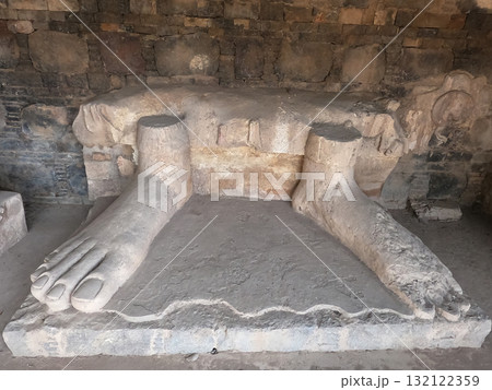 Ancient stone carving of Buddha feet in Dharmarajika Taxila Pakistan symbol of spirituality and historic devotion Ancient stone carving of Buddha feet in Dharmarajika Taxila Pakistan symbol of spirituality and historic devotion 132122359