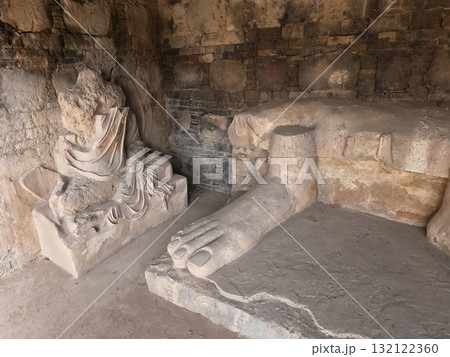 Buddha feet sculpture at ancient Dharmarajika stupa Taxila Pakistan showing Gandhara art heritage and sacred history Buddha feet sculpture at ancient Dharmarajika stupa Taxila Pakistan showing Gandhara art heritage and sacred history 132122360