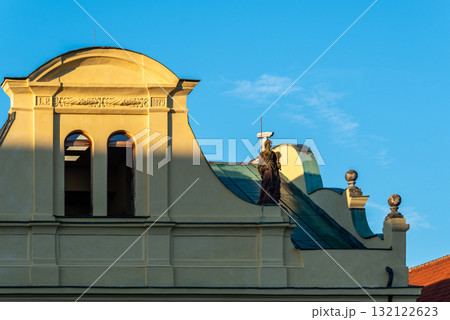 Historic Building Facade with Statue and Blue Sky 132122623