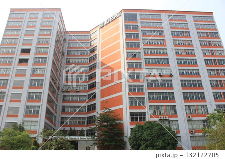 Modern high-rise apartment buildings with many windows and balconies, showcasing urban architecture and residential living 132122705