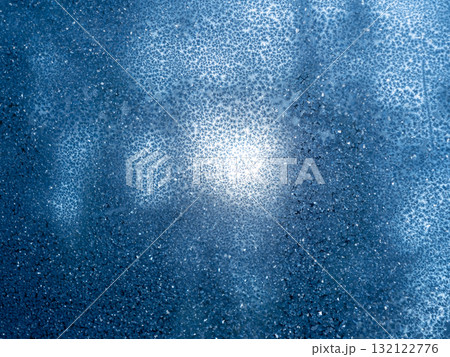 Frosted blue surface with intricate patterns and textures reflecting light in a cold environment during winter Frosted blue surface with intricate patterns and textures reflecting light in a cold environment during winter 132122776