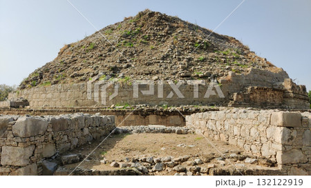 Panoramic view of Dharmarajika Stupa with ancient Buddhist ruins in Taxila Panoramic view of Dharmarajika Stupa with ancient Buddhist ruins in Taxila 132122919
