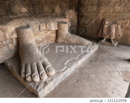 Sacred Buddha feet relic in Dharmarajika ruins Taxila Pakistan representing devotion history and peaceful spirituality 132122936