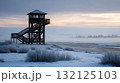 Icy fog enveloping old wooden watchtower in tundra. Life in permafrost conditions, climate change problems on the planet. Global warming 132125103