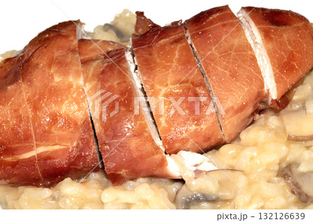 Prosciutto Wrapped Baked Chicken on risotto mushroom close up dinner 132126639