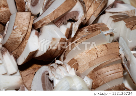 Close up of chopped chestnut mushrooms ready to be cooked fresh produce Close up of chopped chestnut mushrooms ready to be cooked fresh produce 132126724