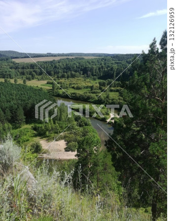 Picturesque River Valley Vista Lush Greenery, Tranquil Waters, and Scenic Landscape Beauty. 132126959