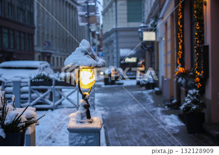 Picturesque winter street of l Riga city with lantern. Picturesque winter street of l Riga city with lantern. 132128909
