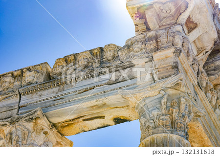Ancient Stone Architecture Showcasing Intricate Details and Carvings in a Clear Sky Background 132131618