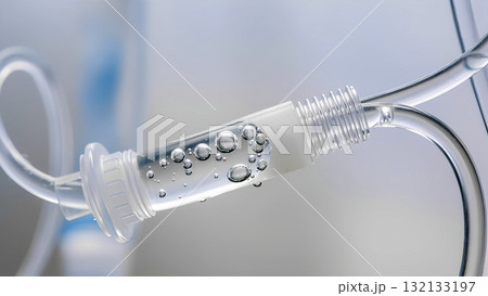 Close-up of a medical IV line with air bubbles. Medical equipment. Close-up of a medical IV line with air bubbles. Medical equipment. 132133197