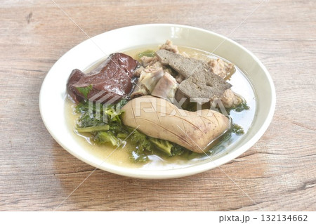 boiled pork blood and entrails with chop pork topping lettuce in soup on plate 132134662