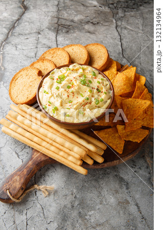 creamy, punchy egg dip that really tastes just like a deviled egg with bread close-up in a plate. Vertical creamy, punchy egg dip that really tastes just like a deviled egg with bread close-up in a plate. Vertical 132134964