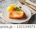 Saganaki authentic Greek cheese appetizer close-up in a plate. Horizontal 132134973
