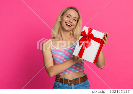 Happy smiling woman stretches out hands presenting birthday gift box promotion holiday discount sale Happy smiling woman stretches out hands presenting birthday gift box promotion holiday discount sale 132135137