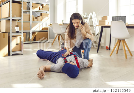 Woman Calls Emergency For Unconscious Worker At Warehouse Woman Calls Emergency For Unconscious Worker At Warehouse 132135549