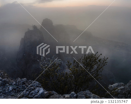 Fog in the high mountains in sunrise 132135747