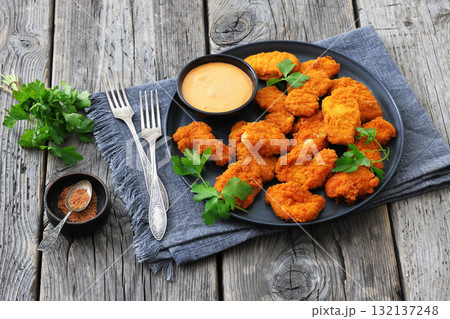 breaded chicken breast chunks with dipping sauce breaded chicken breast chunks with dipping sauce 132137248