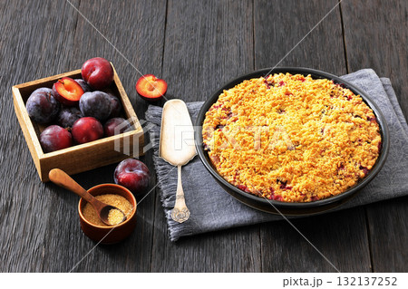 Crumb topped Plum Pie in a baking dish 132137252