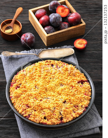 Crumb topped Plum Pie in a baking dish 132137253