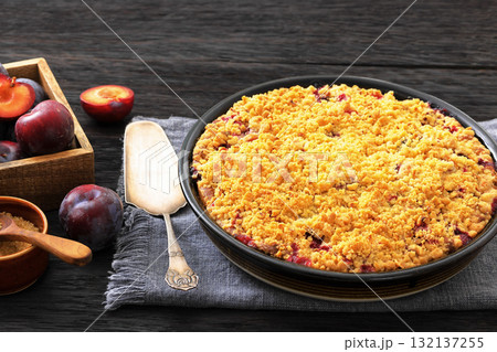 Crumb topped Plum Pie in a baking dish 132137255