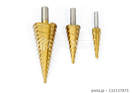 Three Metal Step Drill Bits in Various Sizes on White Background 132137875