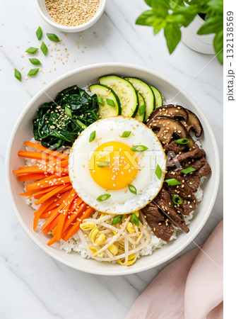 Korean Bibimbap Rice Bowl with Fried Egg and Vegetables 132138569